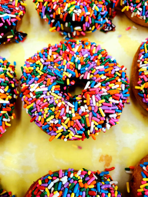 Chocolate Dipped Sprinkle Donuts (Currently Contain SOY)